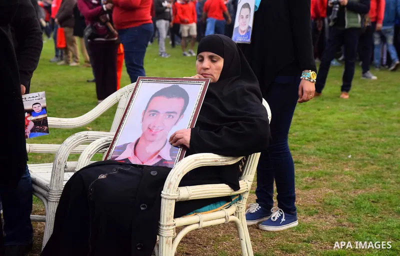 Relatives of al-Ahly fans, who were killed in what known as the "Port Said massacre", attend the fourth anniversary of killing their relatives at al-Ahly club's training stadium, on February 1, 2016. On 1 February 2012,...