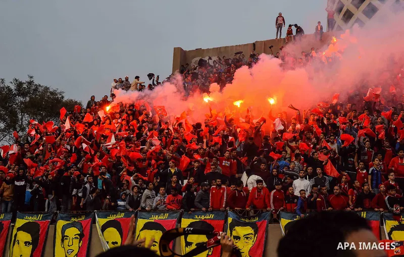 Al Ahly fans, also known as "Ultras", light flares and shout slogans at al-Ahly club's training stadium marking the fourt anniversary of killing al-Ahly fans in what known as the "Port Said massacre", on February 1, 2016...
