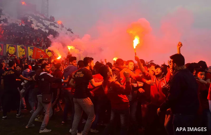 Al Ahly fans, also known as "Ultras", light flares and shout slogans at al-Ahly club's training stadium marking the fourt anniversary of killing al-Ahly fans in what known as the "Port Said massacre", on February 1, 2016...