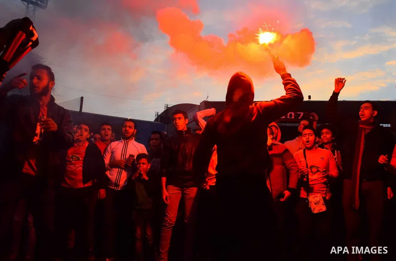 Al Ahly fans, also known as "Ultras", light flares and shout slogans at al-Ahly club's training stadium marking the fourt anniversary of killing al-Ahly fans in what known as the "Port Said massacre", on February 1, 2016...