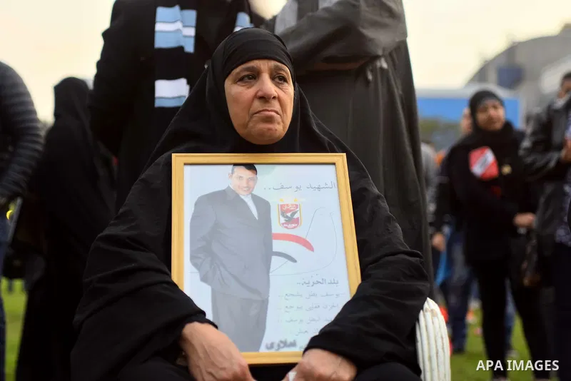 Relatives of al-Ahly fans, who were killed in what known as the "Port Said massacre", attend the fourth anniversary of killing their relatives at al-Ahly club's training stadium, on February 1, 2016. On 1 February 2012,...