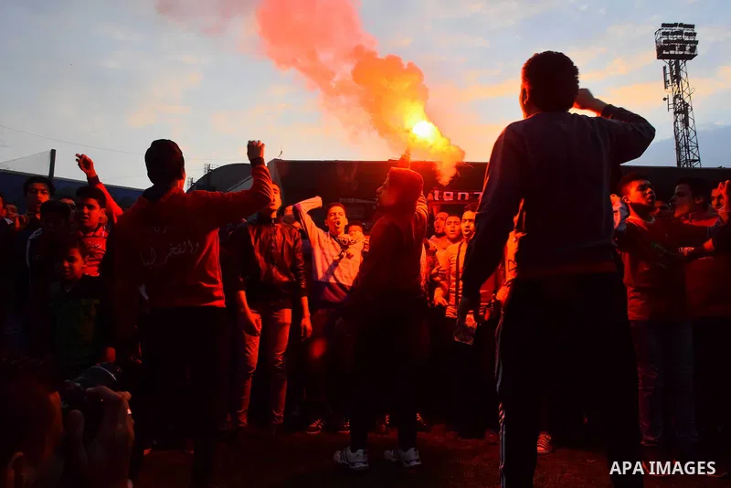 Al Ahly fans, also known as "Ultras", light flares and shout slogans at al-Ahly club's training stadium marking the fourt anniversary of killing al-Ahly fans in what known as the "Port Said massacre", on February 1, 2016...