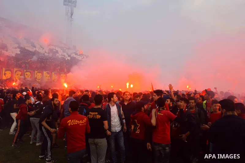Al Ahly fans, also known as "Ultras", light flares and shout slogans at al-Ahly club's training stadium marking the fourt anniversary of killing al-Ahly fans in what known as the "Port Said massacre", on February 1, 2016...