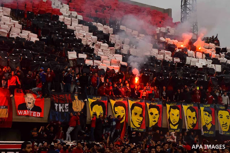 Al Ahly fans, also known as "Ultras", light flares and shout slogans at al-Ahly club's training stadium marking the fourt anniversary of killing al-Ahly fans in what known as the "Port Said massacre", on February 1, 2016...