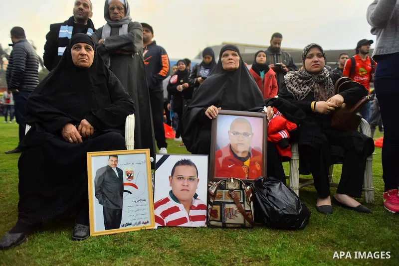 Relatives of al-Ahly fans, who were killed in what known as the "Port Said massacre", attend the fourth anniversary of killing their relatives at al-Ahly club's training stadium, on February 1, 2016. On 1 February 2012,...