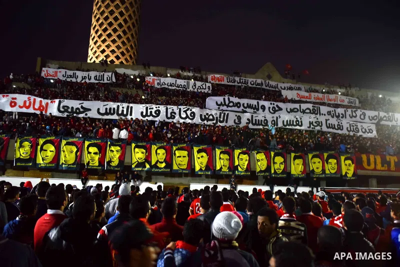 Al Ahly fans, also known as "Ultras", light flares and shout slogans at al-Ahly club's training stadium marking the fourt anniversary of killing al-Ahly fans in what known as the "Port Said massacre", on February 1, 2016...