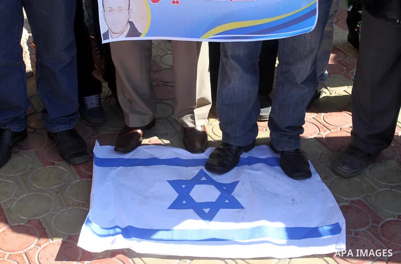 Palestinians take part in a protest to show solidarity with journalist Mohammed al-Qiq who is imprisoned in an Israeli jail in rafah in the southern Gaza strip, on Feb. 03, 2016. Photo by Abed Rahim Khatib