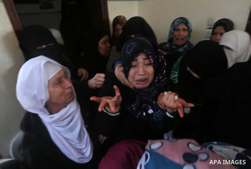 Relatives of Palestinian Hamas militant Ahmed al-Zahar, who was killed when a tunnel collapse on Tuesday, mourn during his funeral in the village of Al-Moghraga near central Gaza Strip, February 3, 2016. The collapse of...