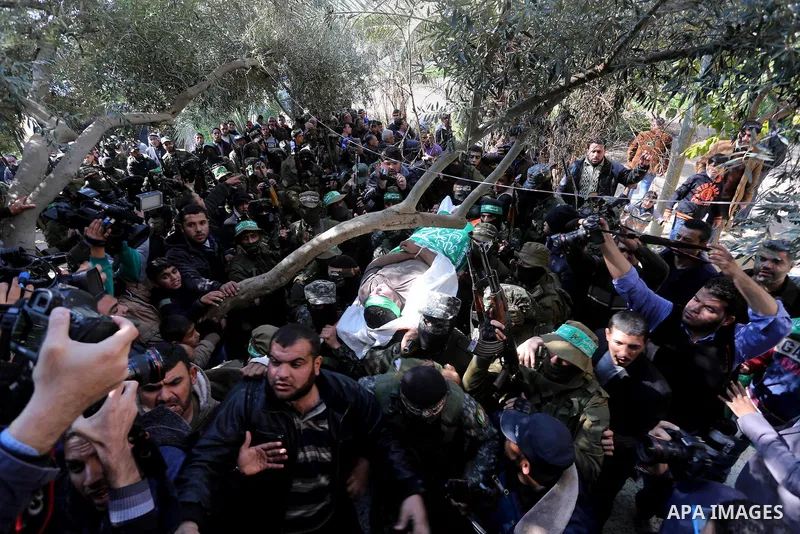 Palestinian militants carry the body of their comrade Ahmed al-Zahar, who was killed when a tunnel collapse on Tuesday, during his funeral in the village of Al-Moghraga near central Gaza Strip, February 3, 2016. The coll...