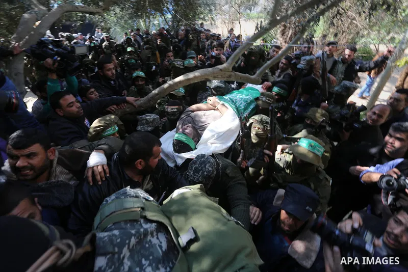 Palestinian militants carry the body of their comrade Ahmed al-Zahar, who was killed when a tunnel collapse on Tuesday, during his funeral in the village of Al-Moghraga near central Gaza Strip, February 3, 2016. The coll...