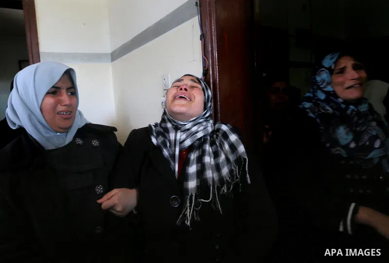 Relatives of Palestinian Hamas militant Ahmed al-Zahar, who was killed when a tunnel collapse on Tuesday, mourn during his funeral in the village of Al-Moghraga near central Gaza Strip, February 3, 2016. The collapse of...