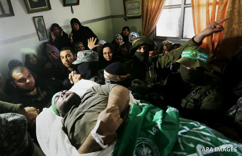 Palestinian militants carry the body of their comrade Ahmed al-Zahar, who was killed when a tunnel collapse on Tuesday, during his funeral in the village of Al-Moghraga near central Gaza Strip, February 3, 2016. The coll...