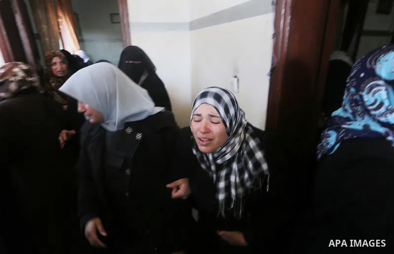 Relatives of Palestinian Hamas militant Ahmed al-Zahar, who was killed when a tunnel collapse on Tuesday, mourn during his funeral in the village of Al-Moghraga near central Gaza Strip, February 3, 2016. The collapse of...