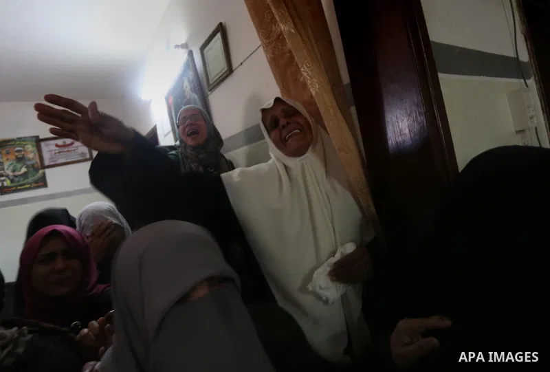 Relatives of Palestinian Hamas militant Ahmed al-Zahar, who was killed when a tunnel collapse on Tuesday, mourn during his funeral in the village of Al-Moghraga near central Gaza Strip, February 3, 2016. The collapse of...