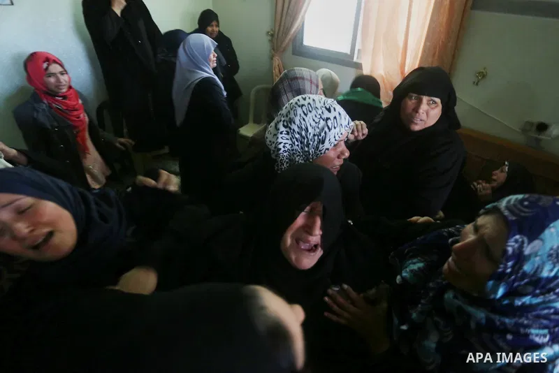 Relatives of Palestinian Hamas militant Ahmed al-Zahar, who was killed when a tunnel collapse on Tuesday, mourn during his funeral in the village of Al-Moghraga near central Gaza Strip, February 3, 2016. The collapse of...