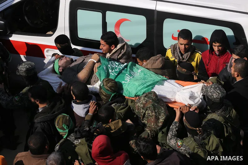 Palestinian militants carry the body of their comrade Ahmed al-Zahar, who was killed when a tunnel collapse on Tuesday, during his funeral in the village of Al-Moghraga near central Gaza Strip, February 3, 2016. The coll...