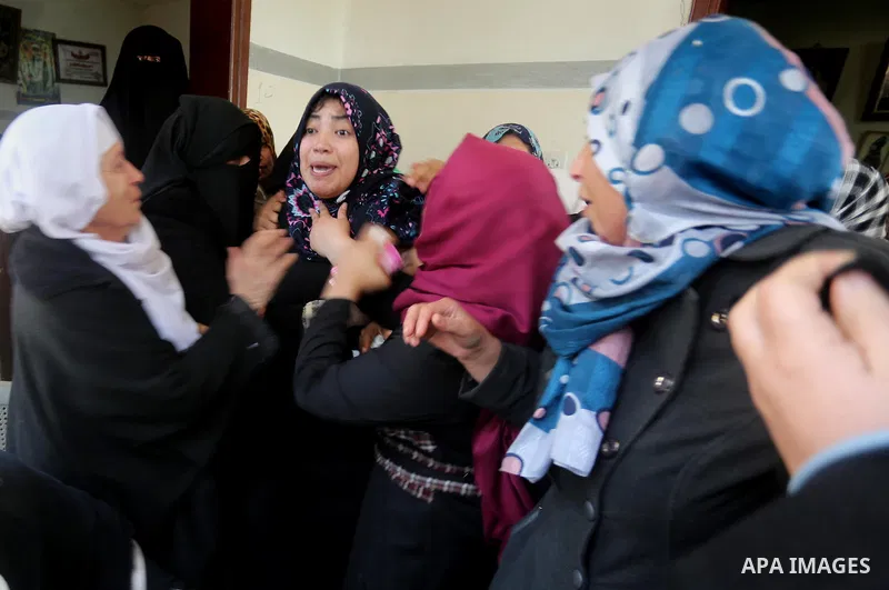 Relatives of Palestinian Hamas militant Ahmed al-Zahar, who was killed when a tunnel collapse on Tuesday, mourn during his funeral in the village of Al-Moghraga near central Gaza Strip, February 3, 2016. The collapse of...