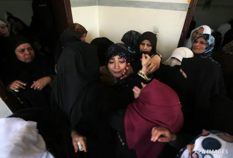 Relatives of Palestinian Hamas militant Ahmed al-Zahar, who was killed when a tunnel collapse on Tuesday, mourn during his funeral in the village of Al-Moghraga near central Gaza Strip, February 3, 2016. The collapse of...