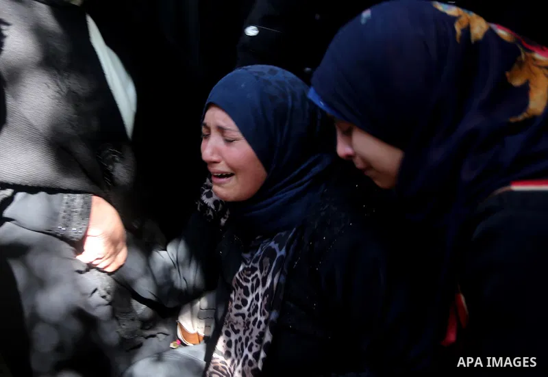 Relatives of Palestinian Hamas militant Ahmed al-Zahar, who was killed when a tunnel collapse on Tuesday, mourn during his funeral in the village of Al-Moghraga near central Gaza Strip, February 3, 2016. The collapse of...