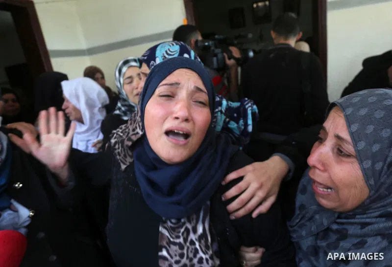 Relatives of Palestinian Hamas militant Ahmed al-Zahar, who was killed when a tunnel collapse on Tuesday, mourn during his funeral in the village of Al-Moghraga near central Gaza Strip, February 3, 2016. The collapse of...