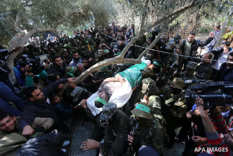 Palestinian militants carry the body of their comrade Ahmed al-Zahar, who was killed when a tunnel collapse on Tuesday, during his funeral in the village of Al-Moghraga near central Gaza Strip, February 3, 2016. The coll...