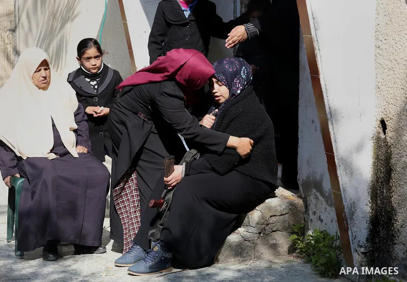 Relatives of Palestinian Hamas militant Ahmed al-Zahar, who was killed when a tunnel collapse on Tuesday, mourn during his funeral in the village of Al-Moghraga near central Gaza Strip, February 3, 2016. The collapse of...