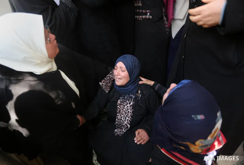 Relatives of Palestinian Hamas militant Ahmed al-Zahar, who was killed when a tunnel collapse on Tuesday, mourn during his funeral in the village of Al-Moghraga near central Gaza Strip, February 3, 2016. The collapse of...
