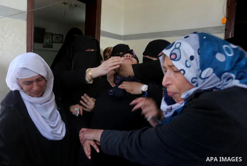 Relatives of Palestinian Hamas militant Ahmed al-Zahar, who was killed when a tunnel collapse on Tuesday, mourn during his funeral in the village of Al-Moghraga near central Gaza Strip, February 3, 2016. The collapse of...