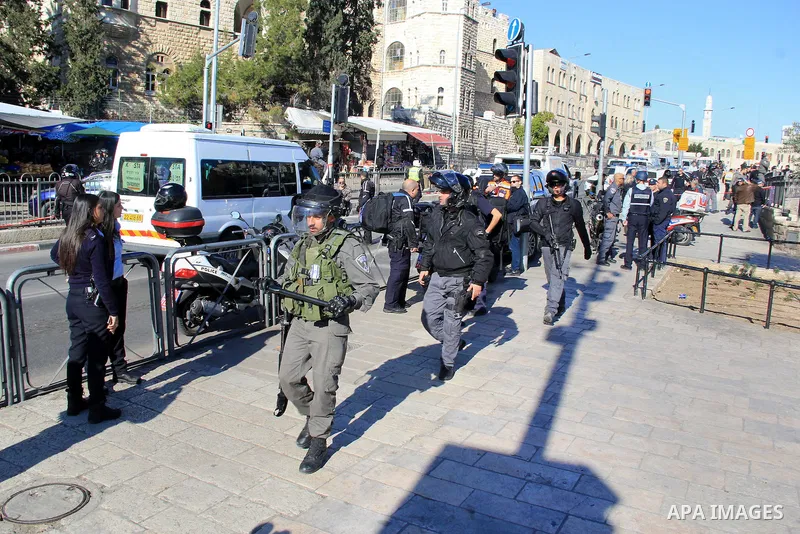 Israeli border policemen stand guard following an attack by three Palestinian assailants at Damascus Gate, a main entrance to Jerusalem's Old City on February 3, 2016. Three Palestinians armed with a gun, knives and expl...
