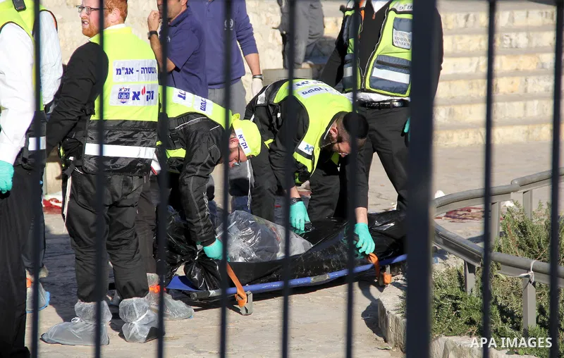 Ultra-Orthodox Jewish Zaka volunteers carry the bodies of two of the reported Palestinian assailants who were killed following an attack at Damascus Gate, a main entrance to Jerusalem's Old City on February 3, 2016. Thre...