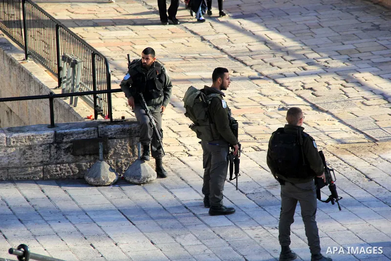 Israeli border policemen stand guard following an attack by three Palestinian assailants at Damascus Gate, a main entrance to Jerusalem's Old City on February 3, 2016. Three Palestinians armed with a gun, knives and expl...