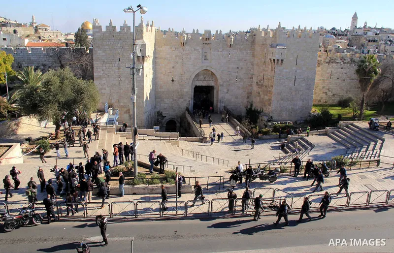 Israeli border policemen stand guard following an attack by three Palestinian assailants at Damascus Gate, a main entrance to Jerusalem's Old City on February 3, 2016. Three Palestinians armed with a gun, knives and expl...