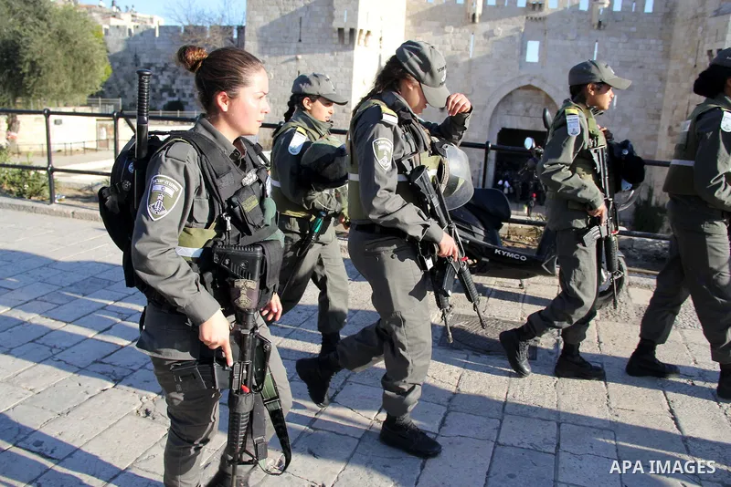Israeli border police-women patrol a street following an attack by three Palestinian assailants at Damascus Gate, a main entrance to Jerusalem's Old City on February 3, 2016. Three Palestinians armed with a gun, knives a...
