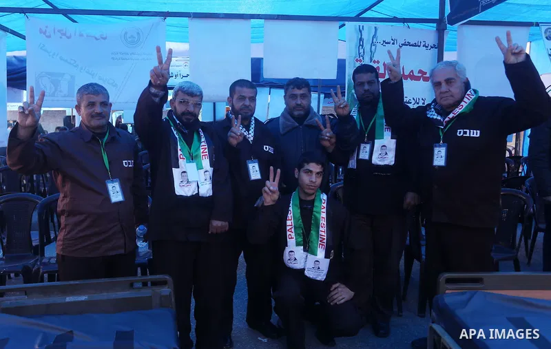 Palestinians take part in a protest to show solidarity with a Palestinian journalist Mohammed al-Qiq who is imprisoned in an Israeli jail in front of Red cross office in Gaza city on Feb. 04, 2016. Qiq is being held unde...