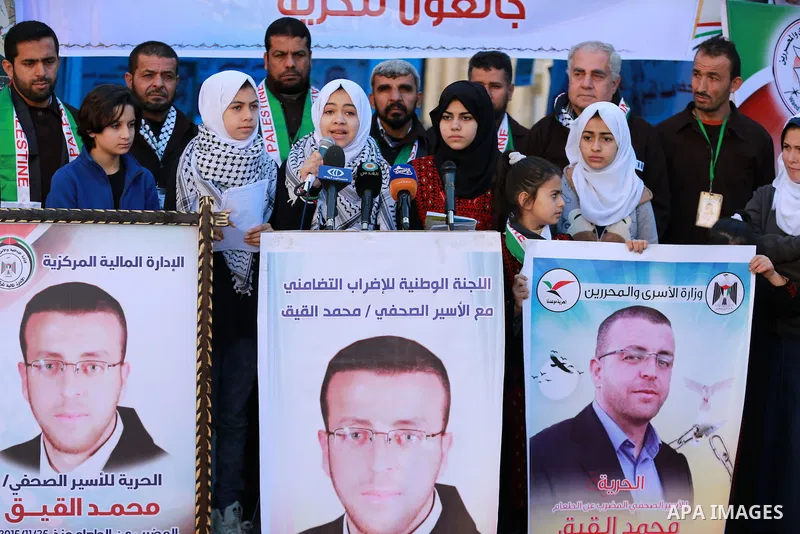 Palestinians take part in a protest to show solidarity with a Palestinian journalist Mohammed al-Qiq who is imprisoned in an Israeli jail in front of Red cross office in Gaza city on Feb. 04, 2016. Qiq is being held unde...
