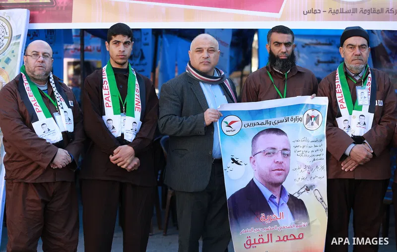 Palestinians take part in a protest to show solidarity with a Palestinian journalist Mohammed al-Qiq who is imprisoned in an Israeli jail in front of Red cross office in Gaza city on Feb. 04, 2016. Qiq is being held unde...