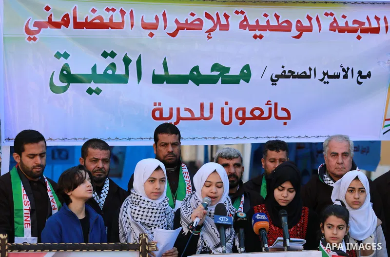 Palestinians take part in a protest to show solidarity with a Palestinian journalist Mohammed al-Qiq who is imprisoned in an Israeli jail in front of Red cross office in Gaza city on Feb. 04, 2016. Qiq is being held unde...