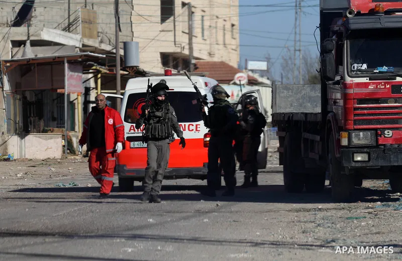 Israeli security forces take a position during clashes with Palestinian protesters in Qabatiya, a town near Jenin in the north of the Israeli-occupied West Bank, on February 4, 2016. Israeli forces locked down Qabatiya t...