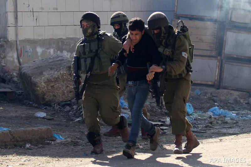 Israeli security forces detain a Palestinian protester during clashes in Qabatiya, a town near Jenin in the north of the Israeli-occupied West Bank, on February 4, 2016. Israeli forces locked down Qabatiya that was home...