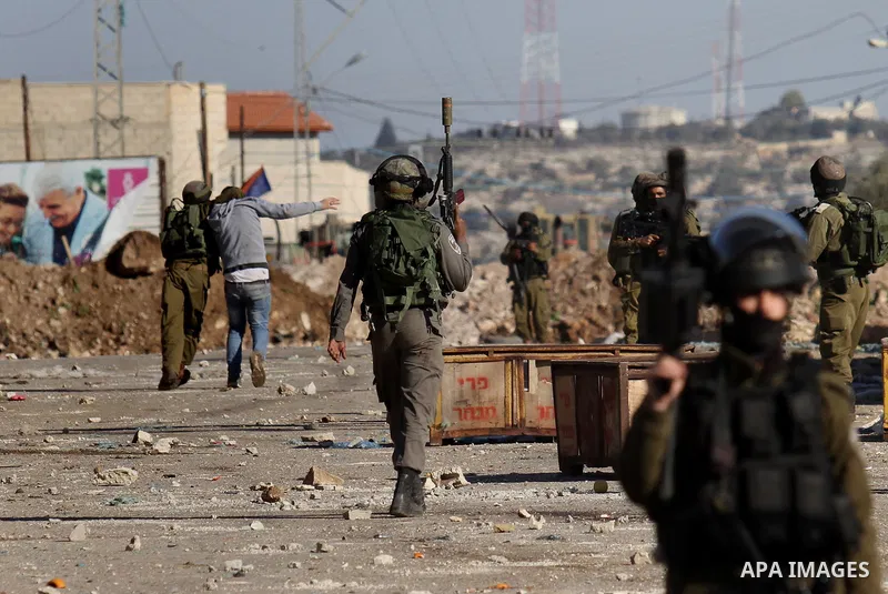 Israeli security forces detain a Palestinian protester during clashes in Qabatiya, a town near Jenin in the north of the Israeli-occupied West Bank, on February 4, 2016. Israeli forces locked down Qabatiya that was home...
