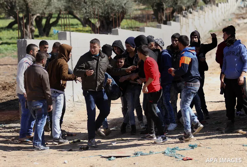 A wounded Palestinian is evacuated during clashes with Israeli security forces in Qabatiya, a town near Jenin in the north of the Israeli-occupied West Bank, on February 4, 2016. Israeli forces locked down Qabatiya that...