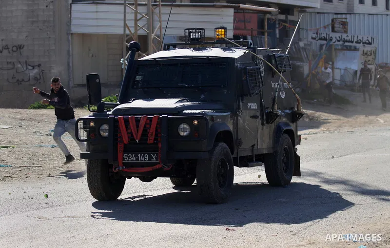 Palestinian protesters hurl stones toward Israeli security forces during clashes in Qabatiya, a town near Jenin in the north of the Israeli-occupied West Bank, on February 4, 2016. Israeli forces locked down Qabatiya tha...