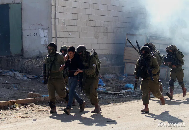 Israeli security forces detain a Palestinian protester during clashes in Qabatiya, a town near Jenin in the north of the Israeli-occupied West Bank, on February 4, 2016. Israeli forces locked down Qabatiya that was home...