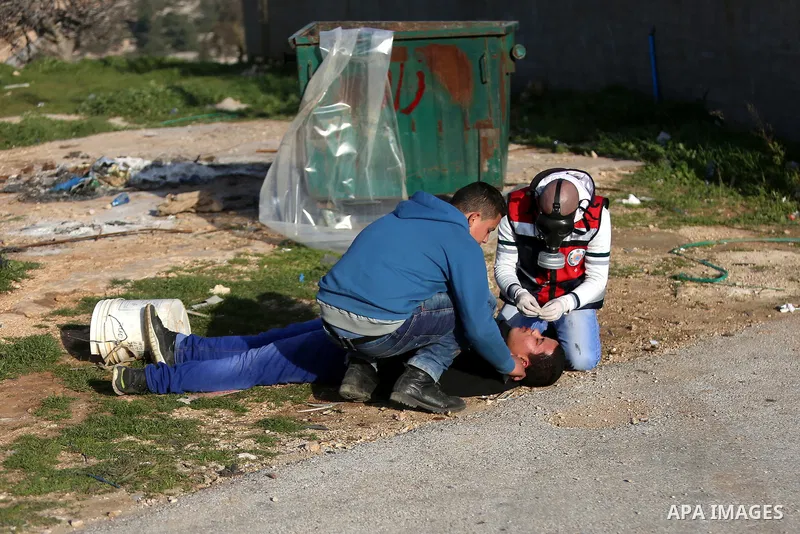 Palestinian protesters clash with Israeli security forces following a demonstration in solidarity with Palestinian prisoners in Israeli jails, outside the compound of the Israeli Ofer Military Prison, near the West Bank...