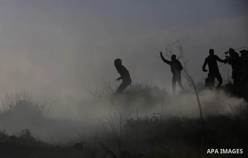 Palestinian protesters clash with Israeli security forces following a demonstration in solidarity with Palestinian prisoners in Israeli jails, outside the compound of the Israeli Ofer Military Prison, near the West Bank...
