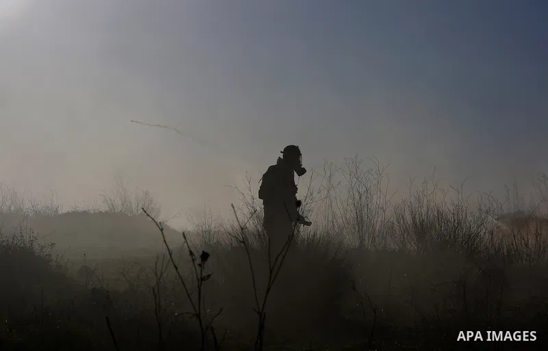 Palestinian protesters clash with Israeli security forces following a demonstration in solidarity with Palestinian prisoners in Israeli jails, outside the compound of the Israeli Ofer Military Prison, near the West Bank...