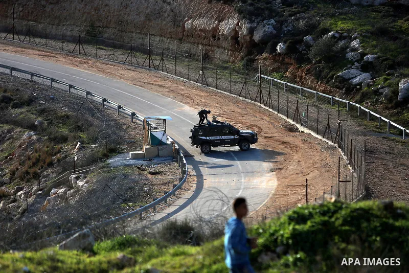 Palestinian protesters clash with Israeli security forces following a demonstration in solidarity with Palestinian prisoners in Israeli jails, outside the compound of the Israeli Ofer Military Prison, near the West Bank...