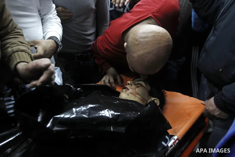 Relatives of Palestinian Haitham Al-Bau, who was shot and killed by Israeli soldiers, mourns at a hospital in the West Bank city of Hebron February 5, 2016. Israeli soldiers shot and killed Al-Bao, 17, in the occupied We...