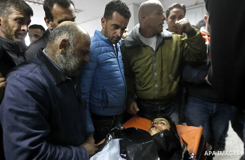 Relatives of Palestinian Haitham Al-Bau, who was shot and killed by Israeli soldiers, mourns at a hospital in the West Bank city of Hebron February 5, 2016. Israeli soldiers shot and killed Al-Bao, 17, in the occupied We...
