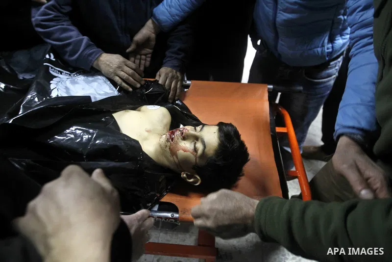 Relatives of Palestinian Haitham Al-Bau, who was shot and killed by Israeli soldiers, mourns at a hospital in the West Bank city of Hebron February 5, 2016. Israeli soldiers shot and killed Al-Bao, 17, in the occupied We...